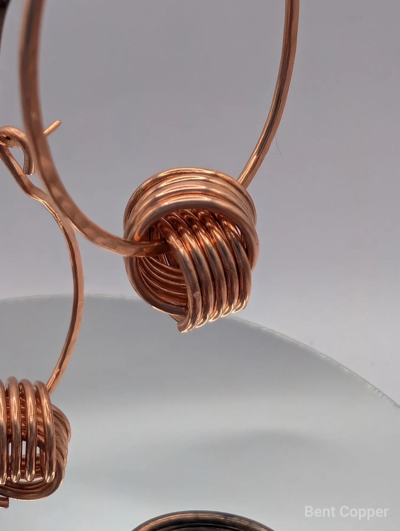 Entwined , handmade copper wire wrapped labradorite earring by Bent Copper